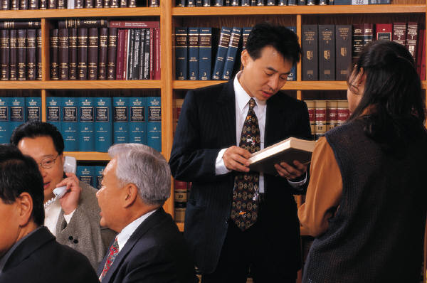 Defense Lawyers at work with Defense legal team researching defense law issues.